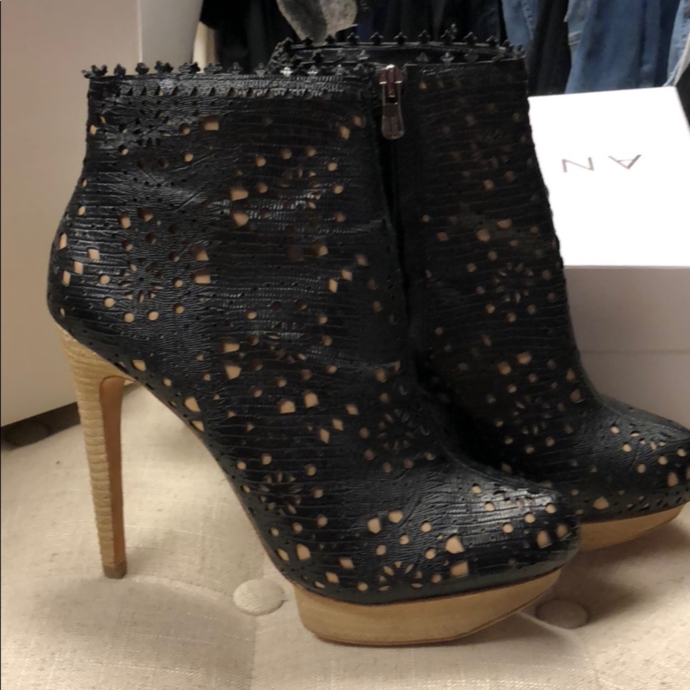 BCBG Maxazria black boots with cut out detail